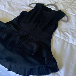 Gracia Sleeveless Black High Low Top